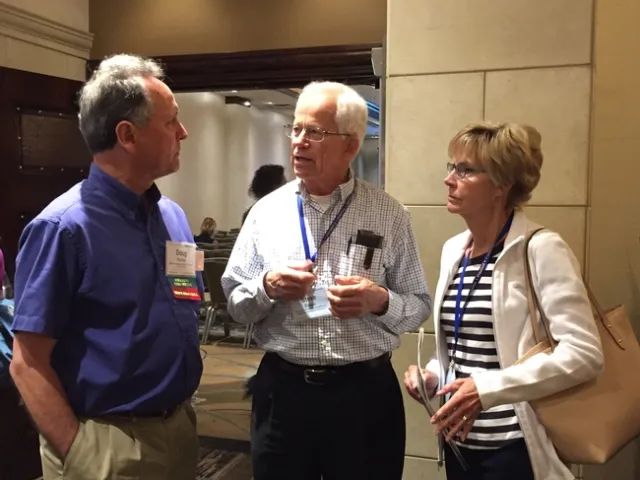 Doug Parker talks with PAC member Steve Sinton and his wife Jane Sinton.