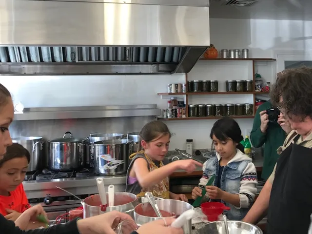 Adults and youth learn how to make strawberry jam. (Photo: Barbara Goldberg)
