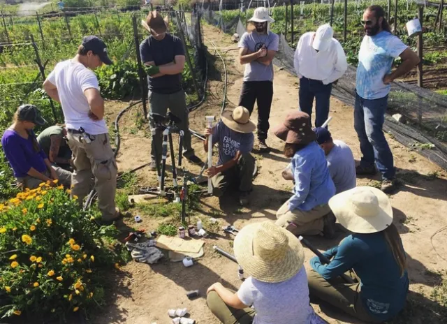 Students at Wild Willow Farm participate in a hands-on plumbing lesson.