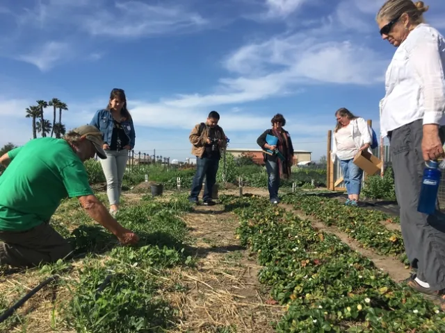 Wild Willow founder Mel Lions with urban agriculture workshop attendees