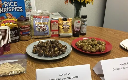 Two differnt varritey of the energy bites sit side by side on a plate, ready to be tasted.