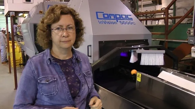 Dr. Beth Grafton-Cardwell in front of the state-of-the-art fruit grader. The equipment purchase was funded by the Citrus Research Board.