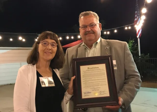 Sutter County Supervisor Mat Conant, right, presented Hasey with a resolution.