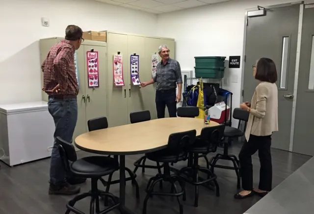 Marisa Neelon, right, shows Mark Lagrimini, left, and Mark Bell the kitchen where UCCE Contra Costa County nutrition educators can prepare food.