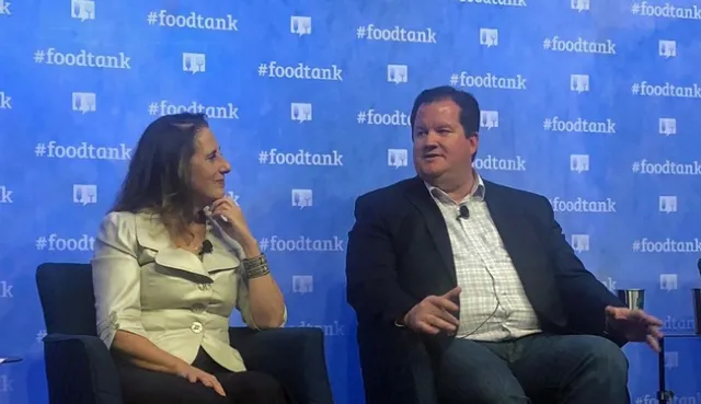 Sarah Mesnick of Scripps Institution of Oceanography at UC San Diego, left, and Gabe Youtsey discuss the role of technology in the food movement at the Food Tank Summit in San Diego.