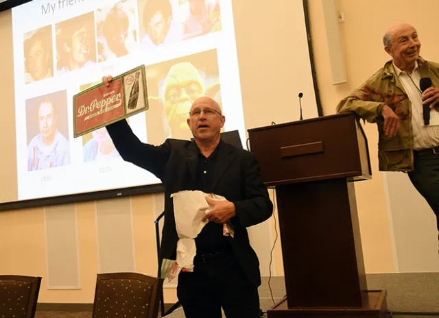 Tom Sparks, who was Hammock's first graduate student at UC Riverside, with a gag gift at the lab reunion. (Photo by Kathy Keatley Garvey)