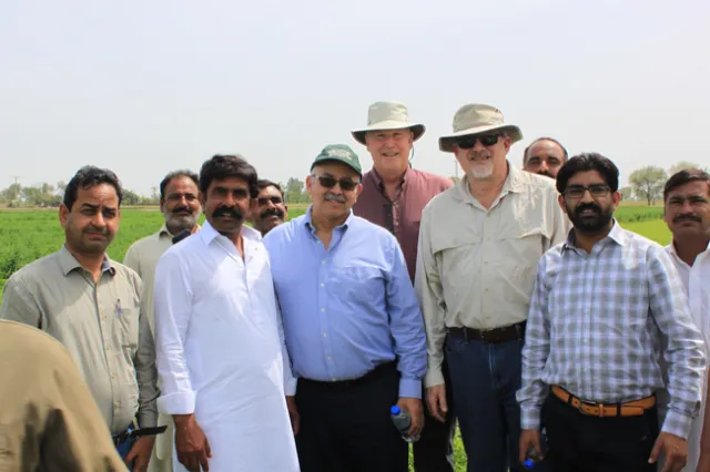 Dr.Khaled Bali (green hat), Dr.Dan Putnam (center back), and Dr.Jeff Dahlberg (tan hat and shirt) meeting with Pakistani improved forage stakeholders.