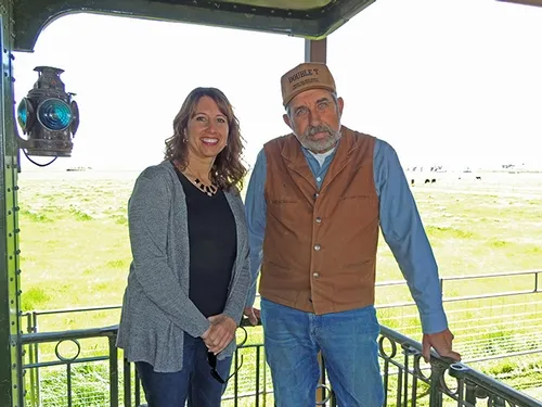 Tony Azevedo with daughter Arlean Azevedo on train porch