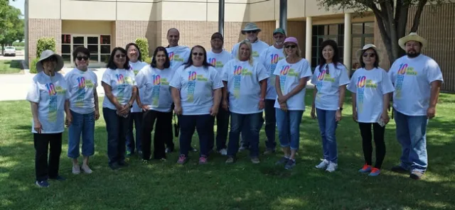 The Kearney walking team poses for a picture before setting out for a lunchtime walk on the center grounds.