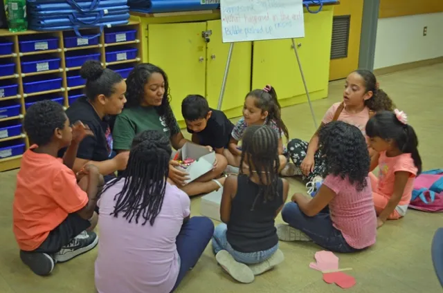 4-H teens ask questions and encourage discovery in their work as science teachers.