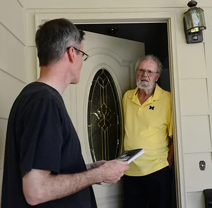 Neal Williams (left), professor of entomology at UC Davis, talks to Robbin Thorp at his home in Davis on April 24. (Photo by Kathy Keatley Garvey)