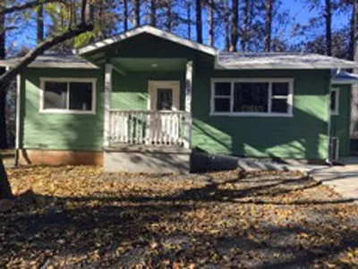 Surviving home with recently upgraded roofing, vents, and combustible materials separated from the house. Every home surrounding this house was lost to the Camp Fire.