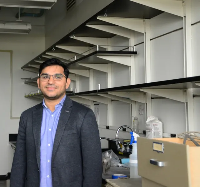 Shahid Masood Siddique stands in front of his lab being renovated. (Photo by Kathy Keatley Garvey)