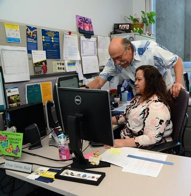 Forensic entomologist Robert Kimsey, master advisor for the animal biology program, UC Davis Department of Entomology and Nematology, confers with academic advisor Elvira Galvan Hack. (Photo by Kathy Keatley Garvey)