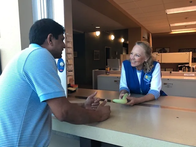 A client asks a question at the Master Gardener Helpdesk.