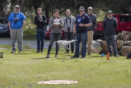 Hastings Natural History Reserve Director Jen Hunter lands a DJI Phantom 3, April 2019