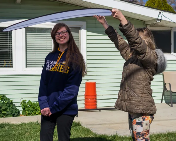 Using a diffuser to soften harsh, mid-day, overhead light.