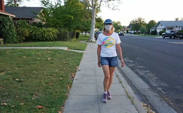 Jeannette Warnert walks wearing a homemade face mask. UC Walks is May 6. Post your UC Walks photos on social media with #UCANRmoves and #ucwalks.