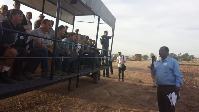 Bachie, shown speaking at a field day in the past, now shares his research results with growers via online events and newsletters.