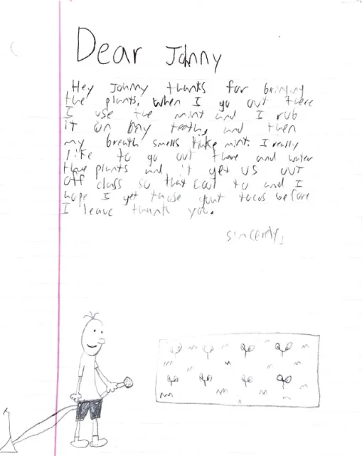 A youth thanked Johnny of Bonnie Plants for donating mint and other plants for the garden.