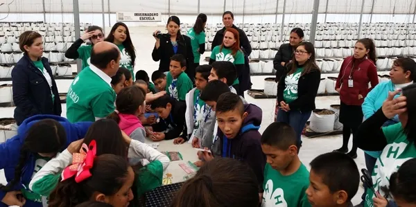 Children in Mexicali, Mexico, plant seeds while learning about food and agriculture. Photo credit: UC ANR.