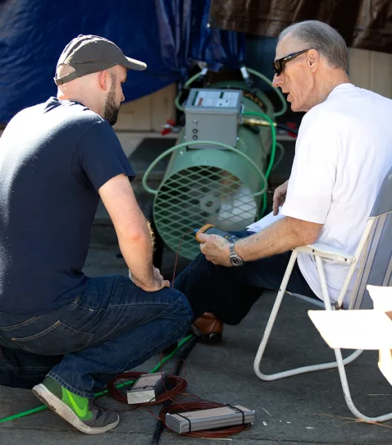 Perry and Michael Linford, CEO of GreenTech Heat Solutions, discuss strategy for heating the structure to kill termites.