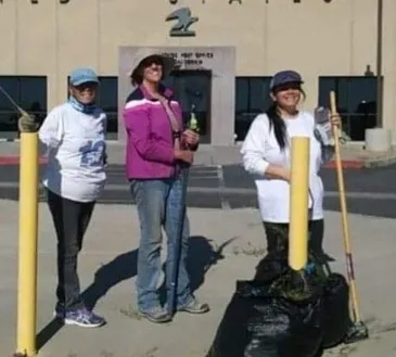 San Bernardino County Master Gardeners Debi Dossey, Meredith Hergenrader,and Darlene House transforming the grounds at the Phelan post office.