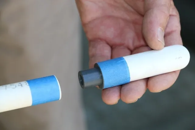 Fig. 5 Painter's tape will protect the outer surface of the ceramic cup from becoming coated with cement and primer.