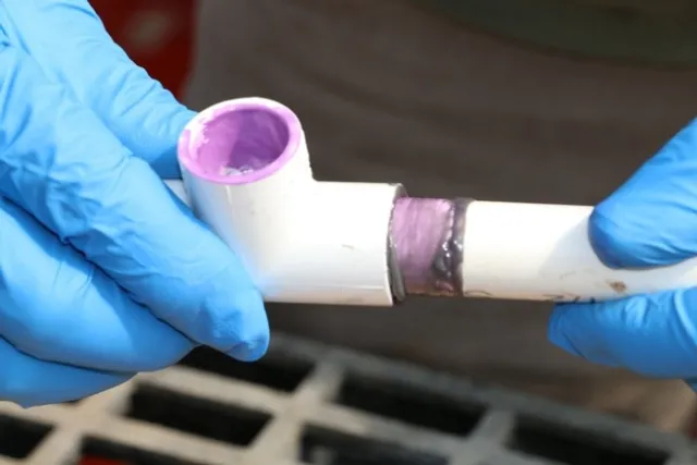 Fig. 10 Add primer to the interior of the “T” and the outside edges of the shafts and bushing. Then coat both surfaces with PVC cement.