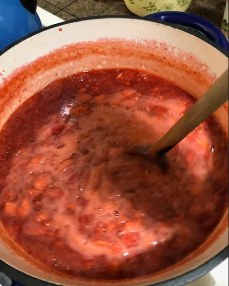 Strawberries and pectin heated to a rolling boil.