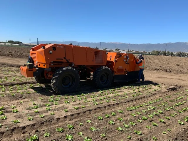 Photo 1. FarmWise Titan autonomous tractor equipped with split knives; it currently does not operate fully autonomously due to Cal OSHA regulations.