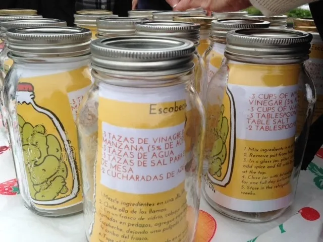 Glass jar with lid. Inside jar is a recipe card