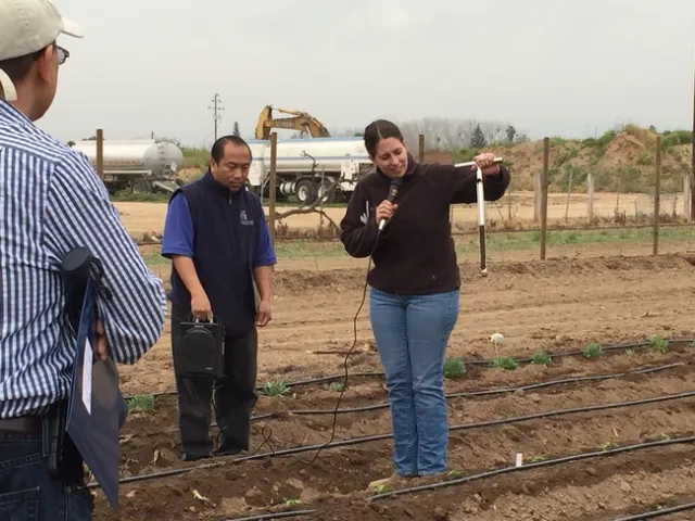 Ruth Dahlquist-Willard shows how to monitor soil moisture at a field day.