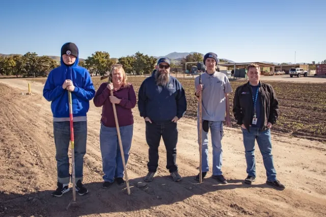 Staff and students in the fields at South Coast REC