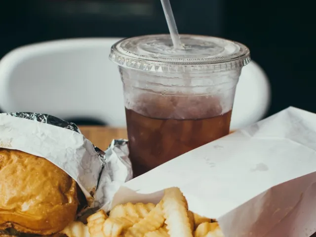 Soft drink with burger and fries
