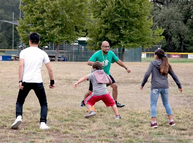 4-H summer camp participants exercise.
