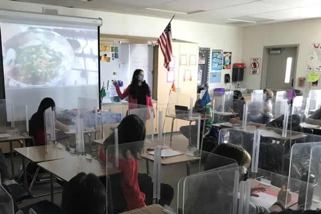 Daisy Valdez teaches students in a classroom