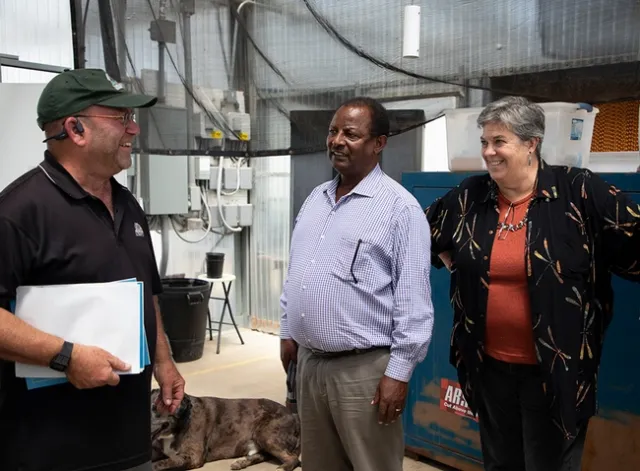 Altman, Bachie and Humiston appear to share a laugh.