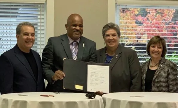 From left, CARCD President Don Butz, USDA NRCS State Conservationist Carlos Suarez, Glenda Humiston and CDFA Secretary Karen Ross sign a memorandum of agreement for the California Conservation Planning Partnership. Photo courtesy of CDFA