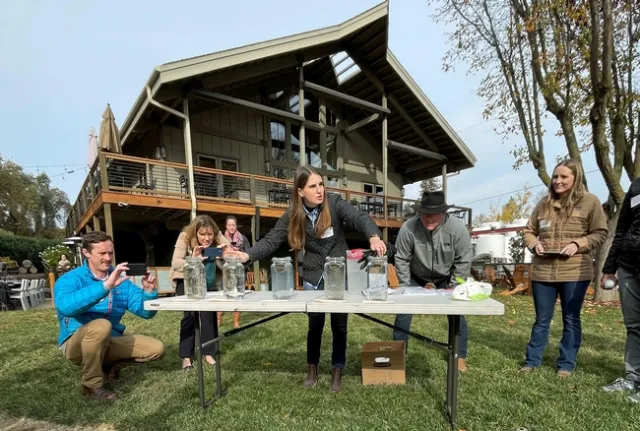 Hope Zabronsky demonstrated how soil aggregates from conventionally tilled fields compared to soil from fields using low-till or no-till farming practices.