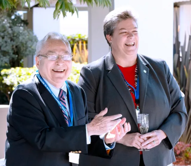 Rosenberg and Humiston share a laugh while standing outdoors.