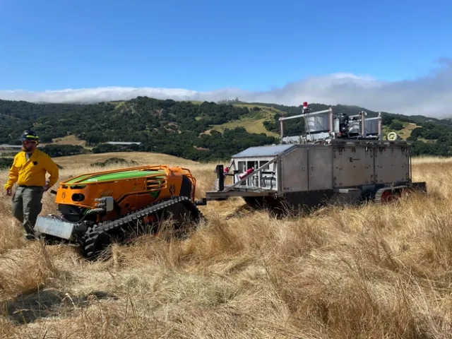 The burn bot unit burns and extinguishes vegetation in an enclosed, controlled environment.