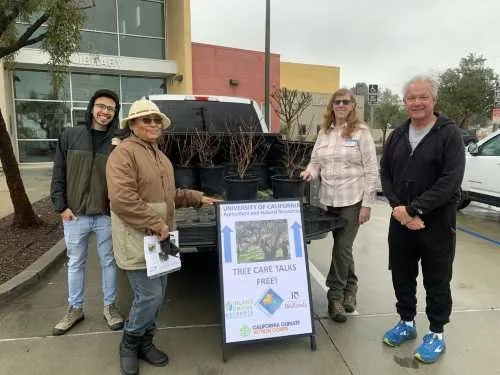 photo of tree recipients and Master Gardeners in Muscoy, California
