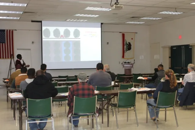 Dr. Peter Larbi teaching sprayer calibration basics during the Airblast Sprayer Calibration Training on November 18, 2022