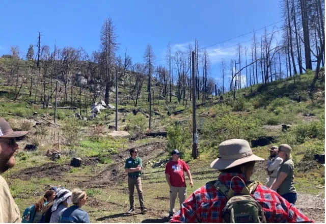 A landowner discusses the challenges of rebuilding post-Creek Fire. Photo credit: Katie Reidy.