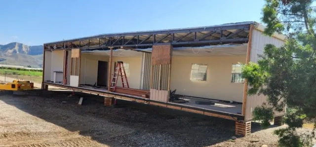 A modular office conference room is split in half in preparation of move.