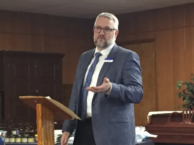 Brent Hales gestures while speaking