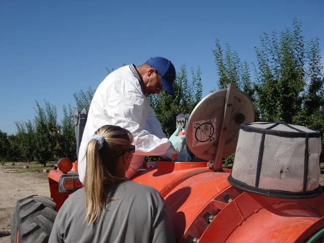 David Ennes carefully adding the experimental product to the air-blast tank.