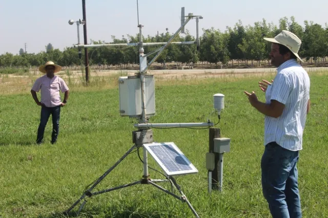 Staff research associate Brady Holder explaining evapotranspiration and CIMIS