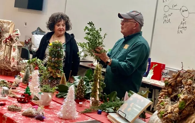 Master Gardeners Patricia Alvarado, left, and Charlie Hindes teach seniors how to decorate for the holidays on a budget. (Photos: Jeannette Warnert)